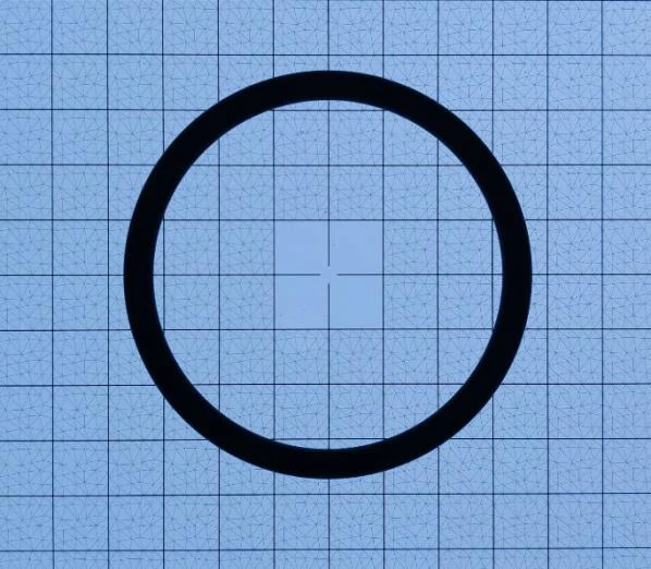 Backlit O-ring on an Olypsys Pro-Vision Booth calibration grid showing high-contrast inner and outer edges
