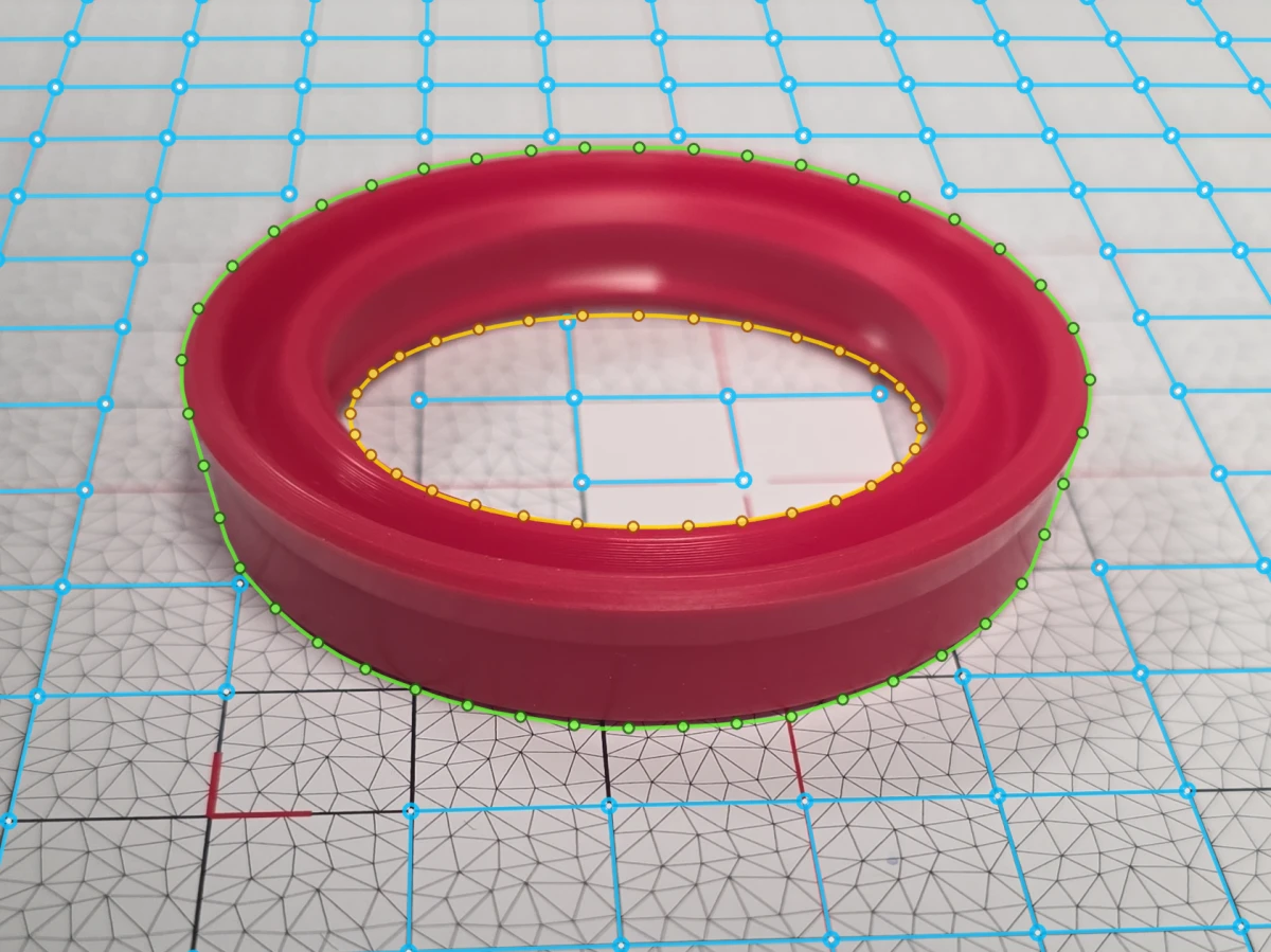 Oblique capture of a polyurethane U-cup seal on an Olypsys grid with solved grid intersections and inner/outer contour outline points